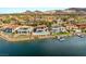 Scenic aerial view of stunning waterfront homes with private docks and lush landscapes, nestled by the water at 32 Grand Corniche Dr, Henderson, NV 89011