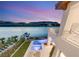 Backyard featuring a pool and lounge chairs near the lake at 32 Grand Corniche Dr, Henderson, NV 89011