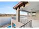 Balcony with stunning lake views and a glimpse of the pool below at 32 Grand Corniche Dr, Henderson, NV 89011