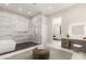 Elegant bathroom featuring a modern tub, glass-enclosed shower, and a stylish vanity area at 32 Grand Corniche Dr, Henderson, NV 89011
