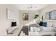Well-lit bedroom with bench, large windows, and comfortable king bed, perfect for relaxation and rest at 32 Grand Corniche Dr, Henderson, NV 89011