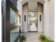 View from the doorway showcases chandelier and seamless transition to lake view beyond at 32 Grand Corniche Dr, Henderson, NV 89011