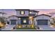 Charming two-story home with symmetrical design, desert landscaping and a three-car garage at 32 Grand Corniche Dr, Henderson, NV 89011
