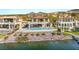Beautiful waterfront home featuring a sparkling pool, outdoor living space, and tranquil views of the lake at 32 Grand Corniche Dr, Henderson, NV 89011