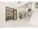 Bright foyer featuring a modern staircase, decorative lighting, and access to a private office at 32 Grand Corniche Dr, Henderson, NV 89011