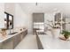 Modern kitchen featuring sleek white cabinets, stainless steel appliances and expansive countertops at 32 Grand Corniche Dr, Henderson, NV 89011