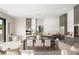 Modern kitchen with sleek cabinetry, stainless steel appliances, and an adjacent dining area at 32 Grand Corniche Dr, Henderson, NV 89011