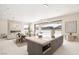 Modern kitchen with a large island, stainless steel appliances, and seamless access to the living area and views at 32 Grand Corniche Dr, Henderson, NV 89011