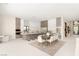 Open-concept kitchen with modern appliances, a center island, and seamless flow to the dining area at 32 Grand Corniche Dr, Henderson, NV 89011