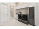 Modern laundry room featuring sleek LG washer and dryer, white cabinets, and neutral color scheme at 32 Grand Corniche Dr, Henderson, NV 89011