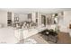 Expansive living area featuring a modern kitchen, dining space, and a comfortable seating area at 32 Grand Corniche Dr, Henderson, NV 89011