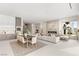 Open-concept living area boasting a fireplace, dining area, and a modern kitchen with luxury finishes at 32 Grand Corniche Dr, Henderson, NV 89011