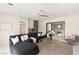 Cozy living room with plush sectional sofa, modern lighting, and access to a wet bar and balcony at 32 Grand Corniche Dr, Henderson, NV 89011