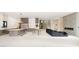 Bright, open-concept living space with modern kitchen, fireplace and dining area at 32 Grand Corniche Dr, Henderson, NV 89011