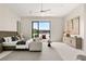 Spacious primary bedroom with a sitting area, modern decor, and scenic views of the lake at 32 Grand Corniche Dr, Henderson, NV 89011
