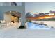 Outdoor kitchen and infinity pool overlooking the lake with mountain views at sunset at 32 Grand Corniche Dr, Henderson, NV 89011