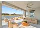 Expansive patio with comfortable seating and stunning lake views creates a serene outdoor living space at 32 Grand Corniche Dr, Henderson, NV 89011