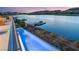Tranquil pool overlooking the lake with an adjacent dock at 32 Grand Corniche Dr, Henderson, NV 89011