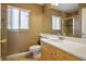 Bathroom showcasing a sink vanity, mirror, and a shower with glass doors at 3331 Cheltenham St, Las Vegas, NV 89129