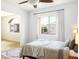 Bedroom with natural light, a large window, neutral bedding and a view to the outside at 3331 Cheltenham St, Las Vegas, NV 89129