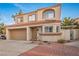 Two story home with a terracotta tile roof, stucco siding, and a two car garage at 3331 Cheltenham St, Las Vegas, NV 89129