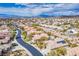 Residential neighborhood with beautiful desert landscape featuring home with solar panels on roof at 34 Contra Costa Pl, Henderson, NV 89052