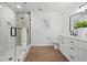 Bright bathroom with a glass shower, framed mirror, and contemporary vanity at 3492 Edison Ave, Las Vegas, NV 89121