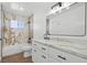 Stylish bathroom featuring a tub with marble surround and modern vanity at 3492 Edison Ave, Las Vegas, NV 89121