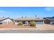 Exterior front view of single story home, landscaped front yard, and driveway at 3492 Edison Ave, Las Vegas, NV 89121