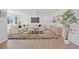 Bright and airy living room featuring a plush sectional sofa, hardwood floors, and modern decor at 3492 Edison Ave, Las Vegas, NV 89121