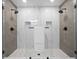 Beautiful, tiled shower with dual shower heads and sleek glass enclosure at 3492 Edison Ave, Las Vegas, NV 89121
