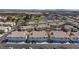 Aerial view of townhomes showing well-manicured exteriors, lush landscaping, and a community pool at 4820 Grey Wolf Ln # 101, Las Vegas, NV 89149
