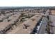 An aerial view capturing a neighborhood with townhomes, a community pool, and beautiful landscaping at 4820 Grey Wolf Ln # 101, Las Vegas, NV 89149