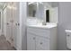 Clean bathroom with white vanity and cabinet storage, plus multiple linen closets at 4820 Grey Wolf Ln # 101, Las Vegas, NV 89149