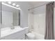 Bright bathroom featuring a shower-tub combo and a white single sink vanity at 4820 Grey Wolf Ln # 101, Las Vegas, NV 89149