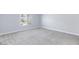 Spacious carpeted bedroom with ample natural light from a large window at 4820 Grey Wolf Ln # 101, Las Vegas, NV 89149