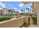 Exterior view of condo complex with lush green landscaping and well-maintained grounds at 4820 Grey Wolf Ln # 101, Las Vegas, NV 89149