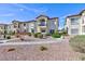 Exterior view of a residential building with desert landscaping and pedestrian walkway at 4820 Grey Wolf Ln # 101, Las Vegas, NV 89149