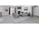 Bright living room with a fireplace, sleek furniture, modern decor, and light-colored wood flooring at 4820 Grey Wolf Ln # 101, Las Vegas, NV 89149