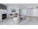 Inviting living room with stylish seating, fireplace, decor, light gray vinyl flooring, and ample natural light at 4820 Grey Wolf Ln # 101, Las Vegas, NV 89149