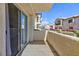 Outdoor patio area with views of the community, palm trees, and blue sky at 4820 Grey Wolf Ln # 101, Las Vegas, NV 89149