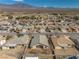Expansive aerial view of a residential neighborhood with mountain views in the background on a sunny day at 5050 Nw Valdez Ct, Pahrump, NV 89060