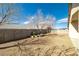 Low-maintenance backyard with gravel landscaping, a block wall, and mature trees at 5050 Nw Valdez Ct, Pahrump, NV 89060