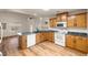Open kitchen with breakfast bar, wood cabinets, recessed lights, and stainless steel appliances at 5050 Nw Valdez Ct, Pahrump, NV 89060