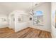 Bright living room with hardwood flooring, white walls, and ample natural light at 5050 Nw Valdez Ct, Pahrump, NV 89060