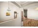 Open-concept living room showcasing hardwood floors and neutral color palette at 5050 Nw Valdez Ct, Pahrump, NV 89060