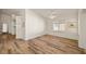 Inviting room with hardwood flooring, ceiling fan, and access to the backyard at 5050 Nw Valdez Ct, Pahrump, NV 89060