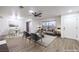 Bright, modern living room featuring a ceiling fan and stylish furniture at 5101 Village Dr, Las Vegas, NV 89142