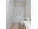 Bright bathroom featuring a shower-tub combo and a vanity with light wood cabinets and a white countertop at 5265 Caspian Springs Dr # 201, Las Vegas, NV 89120