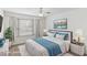Inviting bedroom with a plush bed, soft lighting, and a large window at 5265 Caspian Springs Dr # 201, Las Vegas, NV 89120